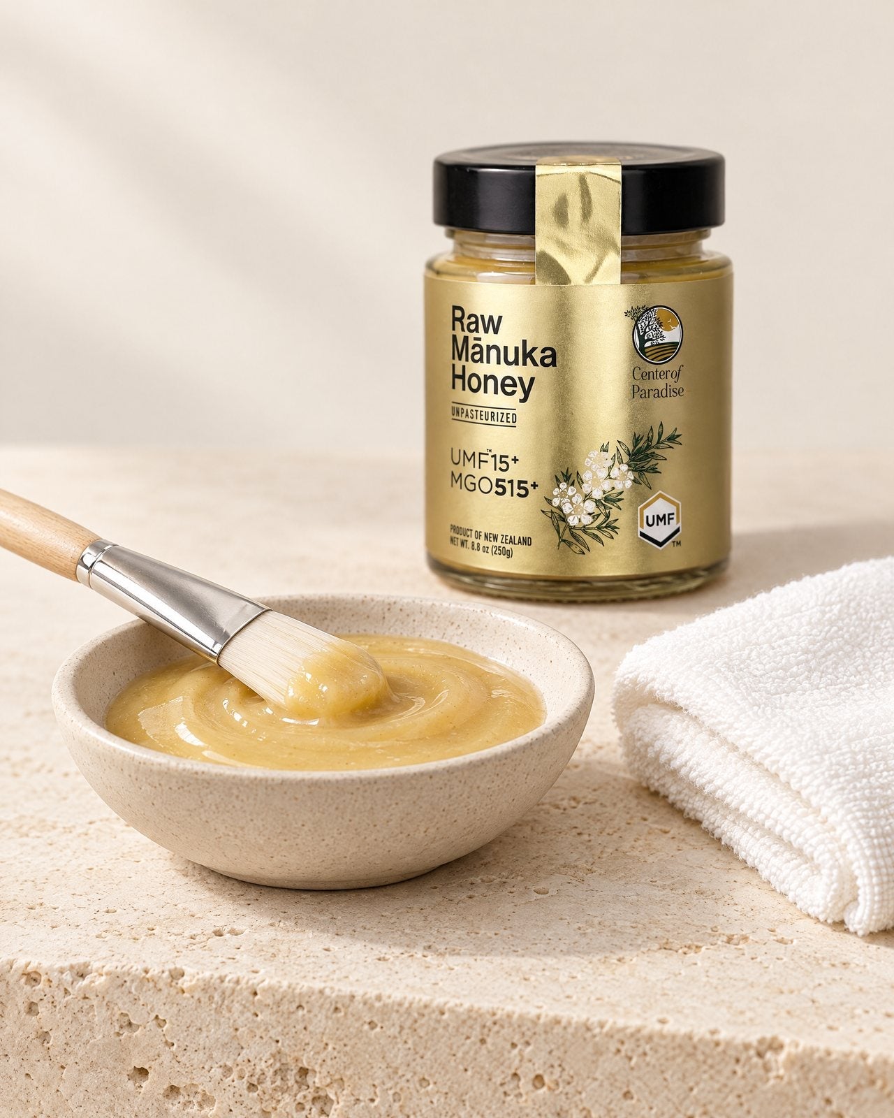 Mānuka honey in a dish with a skincare brush